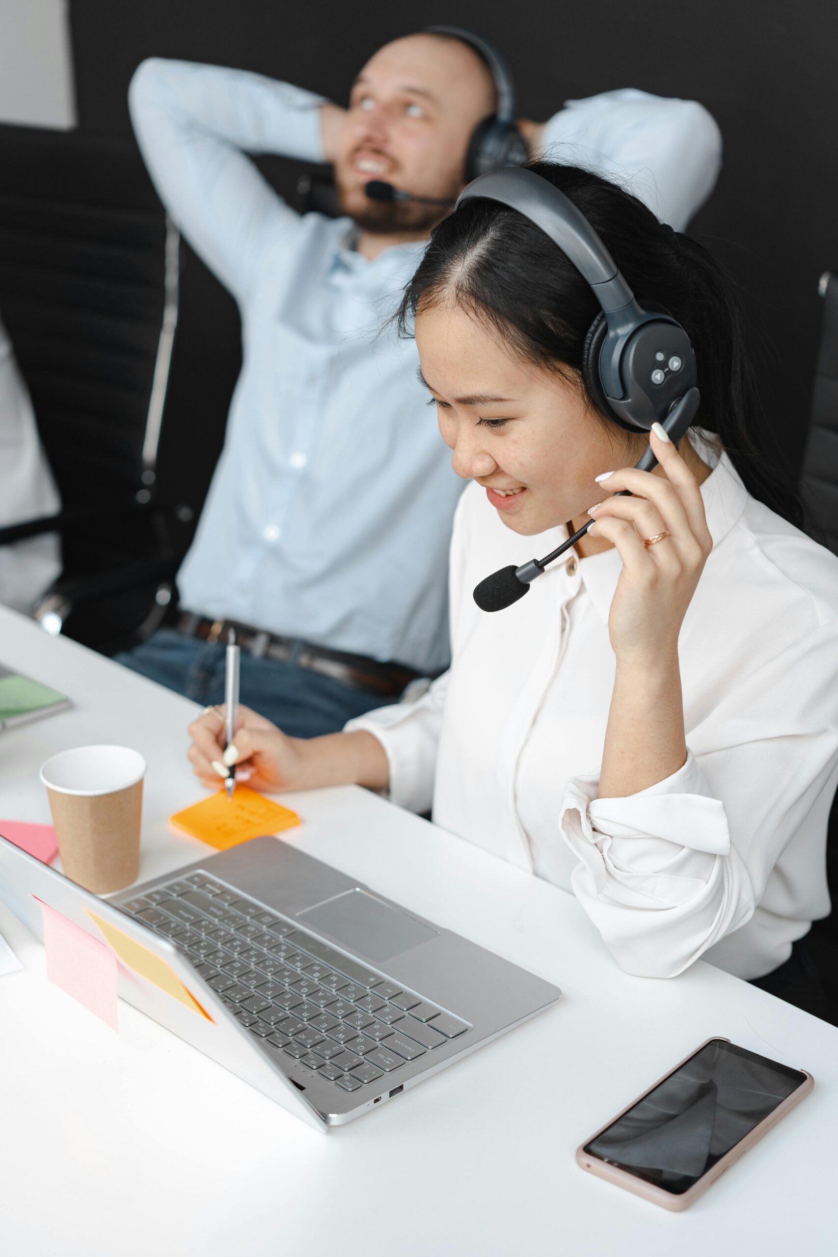 Modern business office utilizing an advanced AI phone system to route customer calls efficiently.