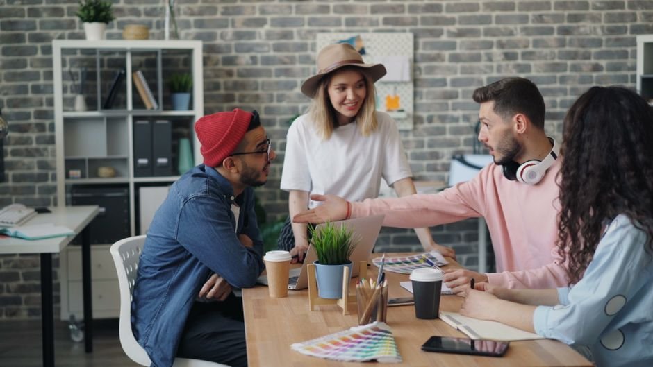 Engineering specialists strategizing a Shopify migration plan in a modern tech office