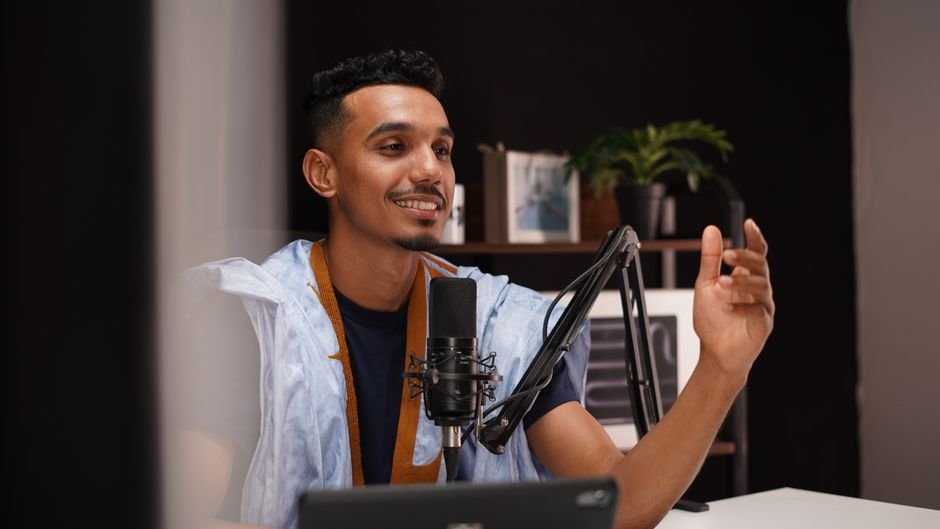 Two podcasters discussing strategy in a modern studio for effective podcast marketing