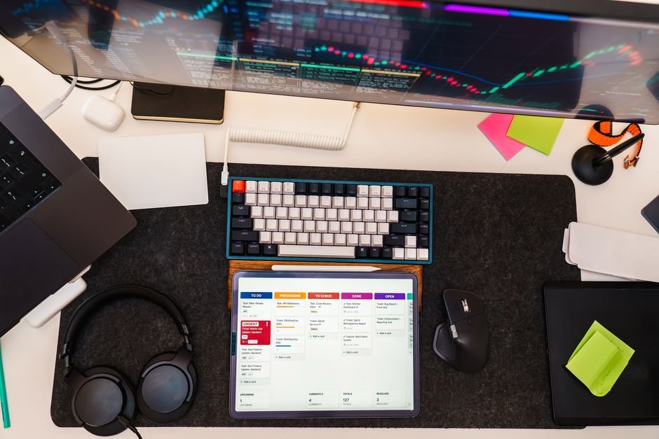 Desktop with digital tools and software, highlighting affordable automation tools.