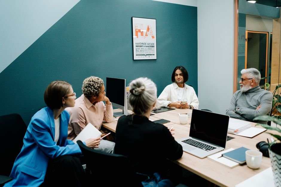 Business team in a modern office discussing voice AI technology solutions