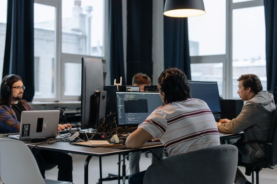 Software development team collaborating intently on a new custom platform